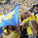 Michigan fans wave a flag from the front row of the stands during the fourth quarter at Michigan Stadium on Saturday. Melanie Maxwell I AnnArbor.com